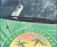  ?? / ?? A flyer for Canada Dry ginger ale left on the windshield of a Reed's corporate vehicle promoting the company's ginger beer.