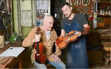  ?? Photos: AFP ?? Cremona’s current oldest luthier, Conia, 74, and his son Stefano Jr, 47, are pictured with a violin at their workshop in Cremona. —