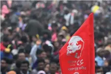  ?? ?? Activists and supporters of Socialist Unity Centre of India (Communist) or SUCI(C) a end a mass meeting organised to conclude the death centenary celebratio­n of Vladimir Lenin, in Kolkata.