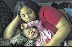  ?? LINDA DAVIDSON / WASHINGTON POST ?? Nakeyja Cade is shown with her year-old daughter Zariyah Cade, whose blood had tested high for lead in Flint, Mich. A new study examines children with elevated blood-lead levels.