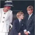 ??  ?? This file photo shows Britain’s Diana, Princess of Wales, left, and her sons Prince Harry, center, and Prince William, as they gather for the commemorat­ions of VJ Day in London.