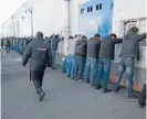  ?? Photo: REUTERS ?? Crackdown: Russian police detain migrant workers during a raid at a vegetable warehouse complex in the Biryulevo district of Moscow.