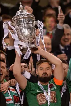  ??  ?? A proud moment for New Ross man Greg Bolger as he collects the FAI Cup on behalf of his Cork City team-mates.