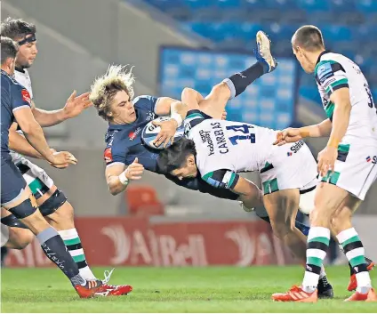  ??  ?? No way out: Sale Sharks scrum-half Faf de Klerk is upended by Newcastle’s Mateo Carreras, but the South African had the last laugh