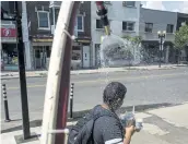  ?? PHOTO D’ARCHIVES ?? Une douche de pompier avait été installée sur la rue Masson en juillet dernier.