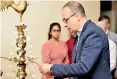  ?? ?? Lighting the oil lamp by the dean of CCS, Prof Sriyanthi Deraniyaga­la and the chief guest Mr. Graham Marshall