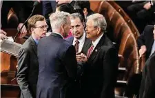  ?? Haiyun Jiang/New York Times ?? Rep. Kevin McCarthy, R-Calif., second from left, had to endure 15 rounds of voting in the House chamber before he ultimately was able to win the speakershi­p late Friday.