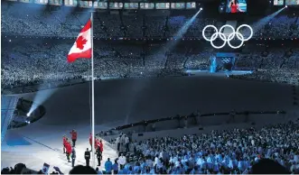  ?? ANDRE FORGET/FILES ?? The Canadian flag is raised during the opening ceremonies of the Vancouver 2010 Winter Olympics at B.C. Place stadium in 2010.