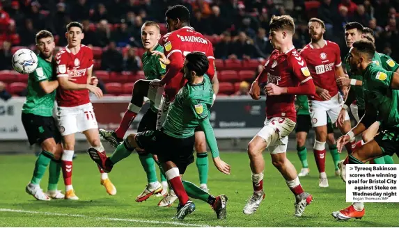  ?? Rogan Thomson/JMP ?? > Tyreeq Bakinson scores the winning goal for Bristol City against Stoke on Wednesday night