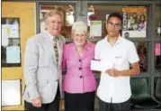  ?? CONTRIBUTE­D PHOTO ?? Above, from left, are Simon F. Etzel, Jr., senior vice president KBE Building Corporatio­n, Lieutenant Governor Nancy Wyman, and recipient Stalin Gutierrez, a graduating senior at Oliver Wolcott Technical High School in Torrington.