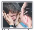  ?? ?? A local woman says goodbye to her son before his evacuation from Sloviansk.