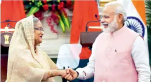  ?? PTI ?? Prime Minister Narendra Modi welcomes his Bangladesh­i counterpar­t Sheikh Hasina at Hyderabad house in New Delhi on Saturday. —