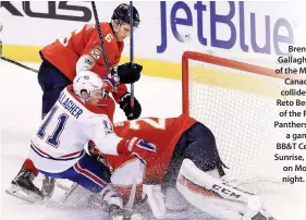  ??  ?? Brendan Gallagher (11) of the Montreal Canadiens collides with Reto Berra (20) of the Florida Panthers during a game at BB&T Center in Sunrise, Florida, on Monday night. (AFP)