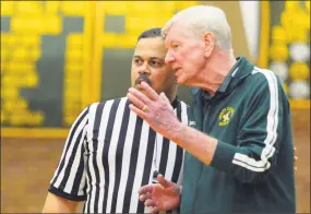  ?? Matthew Brown / Hearst Connecticu­t Media ?? Trinity Catholic coach Mike Walsh confers with a ref on a call against Bassick on Feb. 18, 2017.