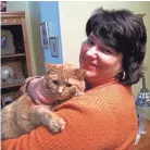  ??  ?? Jennifer Burke and her cat Hippie Chick, who died in 2017.