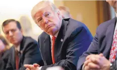  ?? EVAN VICCI/ASSOCIATED PRESS ?? President Trump listens during a meeting with steel and aluminum executives in the Cabinet Room of the White House on Thursday.