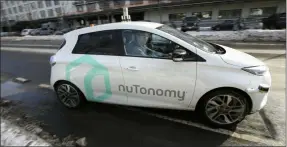  ?? ASSOCIATED PRESS FILE ?? An autonomous vehicle is driven by an engineer on a street in an industrial park in Boston in 2017.