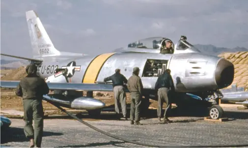  ??  ?? This early F-86E-1 from the 51st FIS before the addition of the checkerboa­rd tail markings. The early “E” model was essentiall­y an F-86A with an all-flying stabilizer. (Photo courtesy of Stan Piet)