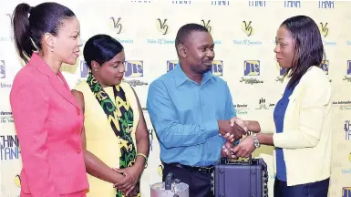  ??  ?? General Manager for Technical Services at the Jamaica Social Investment Fund (JSIF) Loy Malcolm (right) hands over a digitiser and other equipment to Network Manager at the Earthquake Unit, University of the West Indies (UWI), Mona, Paul Williams, to...