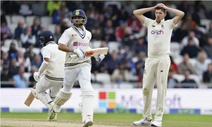  ??  ?? Craig Overton reacts after Virat Kohli and Cheteshwar Pujara score runs for India as the tourists dig in. Photograph: Jon Super/AP
