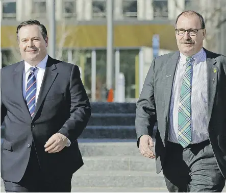  ?? LARRY WONG ?? Newly elected Alberta Progressiv­e Conservati­ve Party leader Jason Kenney and former interim party leader Ric McIver depart after Kenney met with Wildrose leader Brian Jean on March 20.