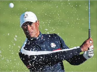 ?? FRANCOIS MORITHE ASSOCIATED PRESS ?? Tiger Woods plays from a bunker on the third hole during a practice session at Le Golf National in Guyancourt, outside Paris, on Tuesday. The 42nd Ryder Cup will be held in France from Sept. 28 to 30.
