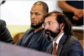  ?? MORGAN LEE / AP ?? Siraj Ibn Wahhaj (left) sits next to public defense attorney Aleks Kostich in New Mexico on Wednesday. He declined to enter a plea.