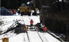  ??  ?? Irish Rail contractor­s repair the track at Inch, Co Wexford, which has closed due to subsidence. Photo: Garry O’Neill