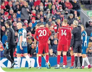  ??  ?? Keeper Alisson sees red and is sent off by referee Martin Atkinson