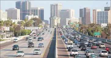  ?? Misael Virgen San Diego Union-Tribune ?? A PROPOSED half-cent sales tax in San Diego County would raise about $18 billion over the next four decades for public transit, bike lanes and specific highway projects. Above: Interstate 5 near downtown San Diego.