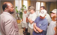  ?? Joe Tabacca / Associated Press file photo ?? Roy Innis, left, head of the Congress of Racial Equality, looks over five Greenwich High School students as they begin orientatio­n for a racial sensitivit­y training course in New York in July 1995.