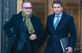  ?? (AP/Mary Altaffer) ?? Igor Fruman (left) leaves the federal court Friday in Manhattan, N.Y., with attorney Todd Blanche after a sentencing hearing.