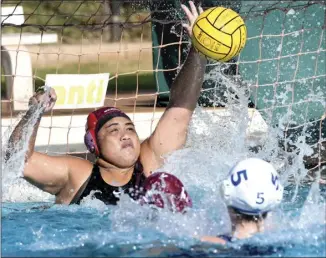  ?? ?? Baldwin High goalie Mariah Kuehu rises to block a third-quarter shot by Seabury Hall’s Christina Naish.