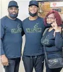  ?? ?? Denzel Irvin, a Foundation Academy and University of Charlotte football standout, is flanked by his parents Djuan and Gwendolyn Irvin as he leaves Charlotte’s Atrium Hospital six days after receiving a heart transplant.