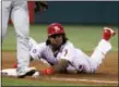  ?? TOM MIHALEK — THE ASSOCIATED PRESS ?? Philadelph­ia Phillies’ Maikel Franco advances to third on a wild pitch during the second inning of the team’s baseball game against the Miami Marlins, Wednesday in Philadelph­ia.