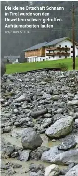  ?? APA/ZEITUNGSFO­TO.AT ?? Die kleine Ortschaft Schnann in Tirol wurde von den Unwettern schwer getroffen. Aufräumarb­eiten laufen