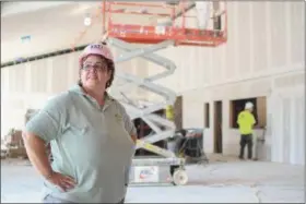  ?? ERIC BONZAR — THE MORNING JOURNAL ?? Rev. Rosalina Rivera stands near the main entrance point of First Lutheran Church and admires the work being done on the facility’s sanctuary, Sept. 26. Rivera says she expects to hold the congregati­on’s first worship service on Nov. 19.