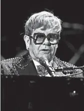  ?? ANGELA WEISS/GETTY-AFP ?? Elton John performs Jan. 30 at a concert that will air April 10. Two star-sung cover albums are on the way.