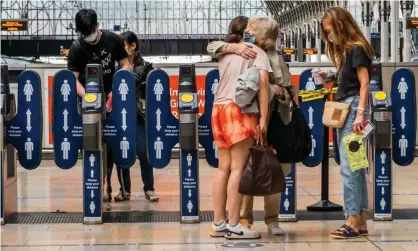  ?? Photograph: Guy Bell/Rex/Shuttersto­ck ?? ‘The release of oxytocin is context-dependent: only when a hug is wanted will the comforting and rewarding effects be felt.’ Paddington station, London, August 2020.