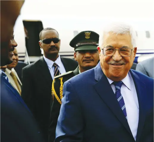  ??  ?? PALESTINIA­N AUTHORITY PRESIDENT Mahmoud Abbas smiles during his arrival for an official visit at Khartoum Airport in July.