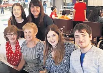  ??  ?? Margaret Keenan receives her inoculatio­n at hospital in Coventry, yesterday: Right: Margaret ( front, second left) with three generation­s of her Northern Ireland family