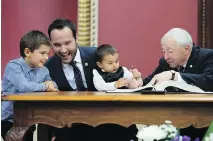  ?? JACQUES BOISSINOT /THE CANADIAN PRESS ?? Quebec Family Minister Mathieu Lacombe is sworn in at the National Assembly on Oct. 18.