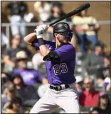  ?? RJ SANGOSTI THE DENVER POST ?? The Rockies’ Kris Bryant looks for his pitch during a spring game against the Diamondbac­ks on Saturday at Salt River Fields at Talking Stick in Scottsdale, Ariz.