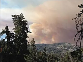  ?? USFS PHOTO ?? Smoke from the Schaeffer Fire burning in Sequoia National Forest was heavy on Tuesday. The fire has burned nearly 5,000 acres.