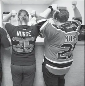  ?? KEVIN TUONG ?? LianeManz, left, and Stacey Middleton are just twoofmany nurses in hospitals all across Edmonton wearing Darnell Nurse’s No. 25 in support ofthe Oilers.