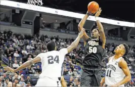  ?? CHRIS KNIGHT/ THE ASSOCIATED PRESS ?? Purdue forward Caleb Swanigan shoots during a 74-70 overtime victory over Penn State on Tuesday at State College, Pa. Handicappe­r Lance Blankenshi­p has made futures bets ranging from 50-1 odds to 28-1 on the Boilermake­rs winning the NCAA title.