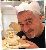  ??  ?? Prize porker: Paul Hollywood poses with a marzipan pig, part of yesterday’s fun