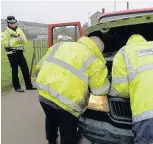  ??  ?? Check officers carried out road checks