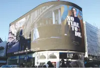  ?? ( Lisi Niesner/ Reuters) ?? A BILLBOARD for ‘ No Time to Die’ is displayed at Piccadilly Circus in London, late last year.