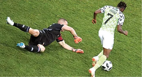  ?? PHOTO: AFP ?? Nigeria’s striker Ahmed Musa dribbles Iceland’s goalkeeper Hannes Halldorsso­n before scoring his second goal at Russia 2018 World Cup. Saudi Arabia is plotting to co- host the 2030 edition with Italy, Morocco and Egypt